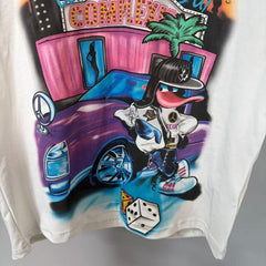 Triple Sevens Off‑White Rhinestone City Cartoon Scene Graphic Tee