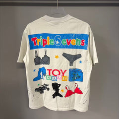 Triple Sevens Off‑White Colorful Cartoon Store Scene Graphic Tee