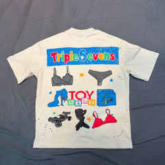 Triple Sevens Off‑White Colorful Cartoon Store Scene Graphic Tee